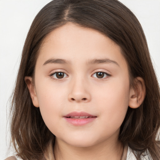 Joyful white child female with long  brown hair and brown eyes