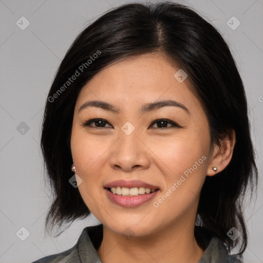 Joyful asian young-adult female with long  brown hair and brown eyes