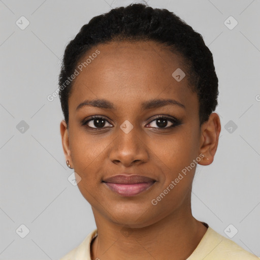 Joyful black young-adult female with short  black hair and brown eyes