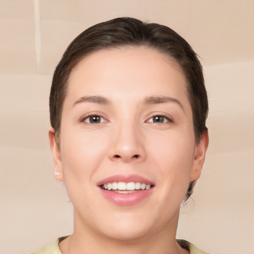 Joyful white young-adult female with short  brown hair and brown eyes