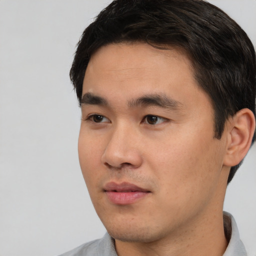 Neutral asian young-adult male with short  black hair and brown eyes
