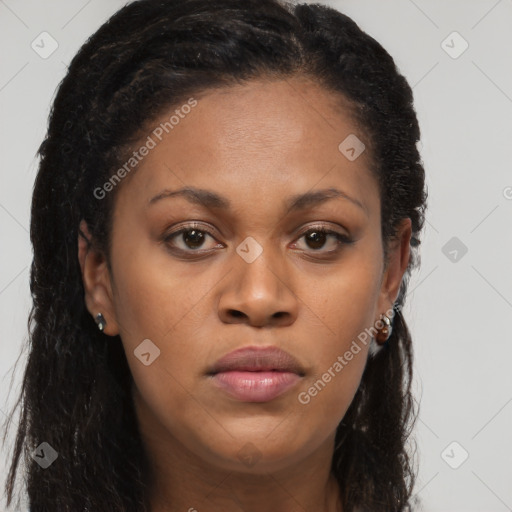 Joyful black young-adult female with long  brown hair and brown eyes