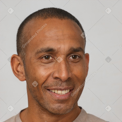 Joyful black adult male with short  black hair and brown eyes