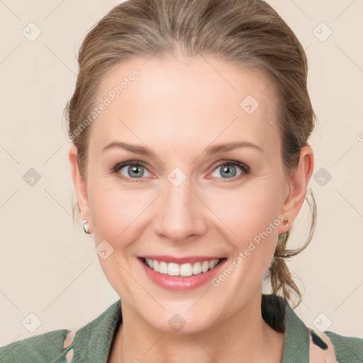 Joyful white young-adult female with medium  brown hair and blue eyes