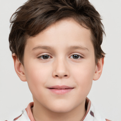 Joyful white child male with short  brown hair and brown eyes