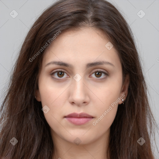 Neutral white young-adult female with long  brown hair and brown eyes