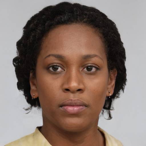 Neutral black young-adult female with short  black hair and brown eyes