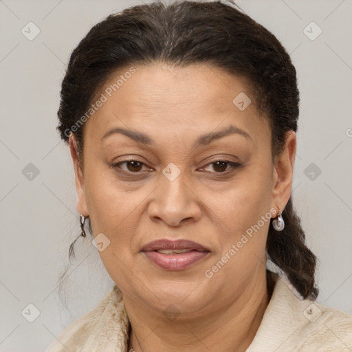 Joyful latino adult female with short  brown hair and brown eyes