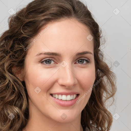 Joyful white young-adult female with long  brown hair and green eyes