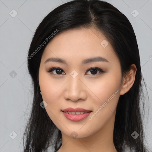 Joyful asian young-adult female with long  brown hair and brown eyes