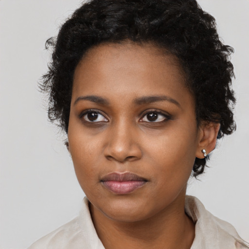 Neutral black young-adult female with short  brown hair and brown eyes