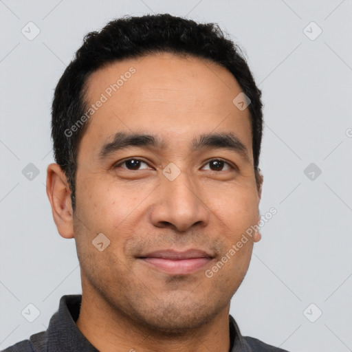 Joyful latino young-adult male with short  black hair and brown eyes