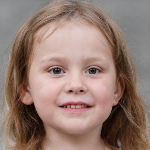 Joyful white child female with medium  brown hair and blue eyes