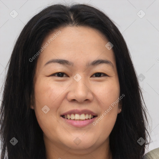 Joyful asian young-adult female with long  brown hair and brown eyes