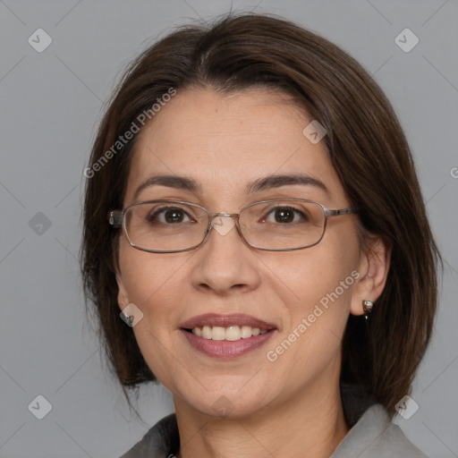 Joyful white adult female with medium  brown hair and brown eyes