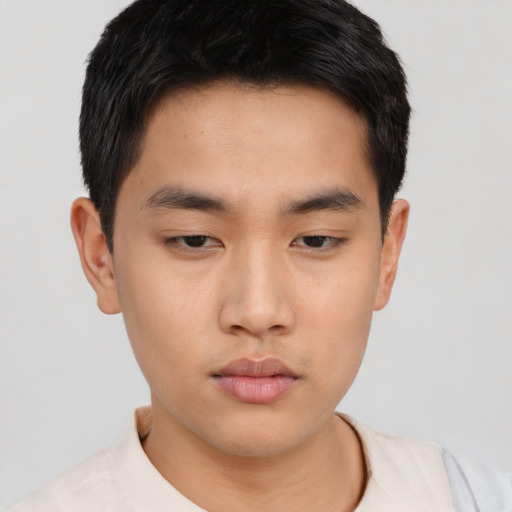 Neutral asian young-adult male with short  brown hair and brown eyes