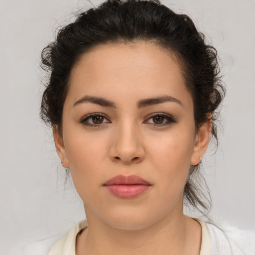 Neutral latino young-adult female with medium  brown hair and brown eyes
