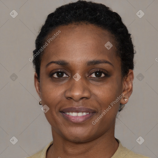 Joyful black young-adult female with short  black hair and brown eyes