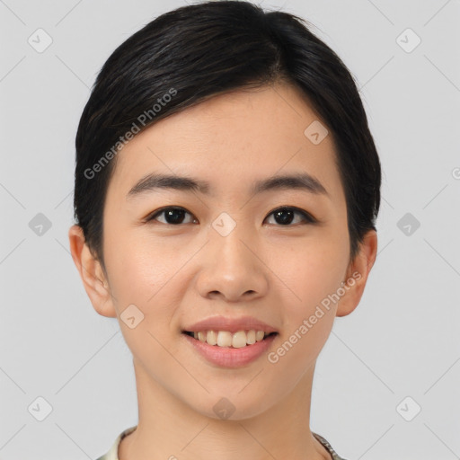 Joyful asian young-adult female with short  brown hair and brown eyes