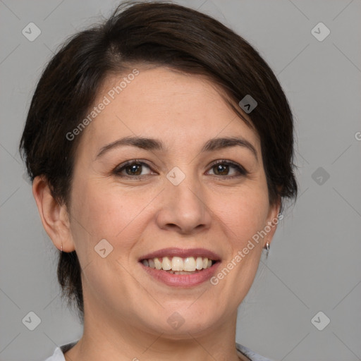 Joyful white adult female with medium  brown hair and brown eyes