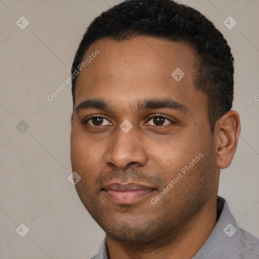 Joyful black young-adult male with short  black hair and brown eyes