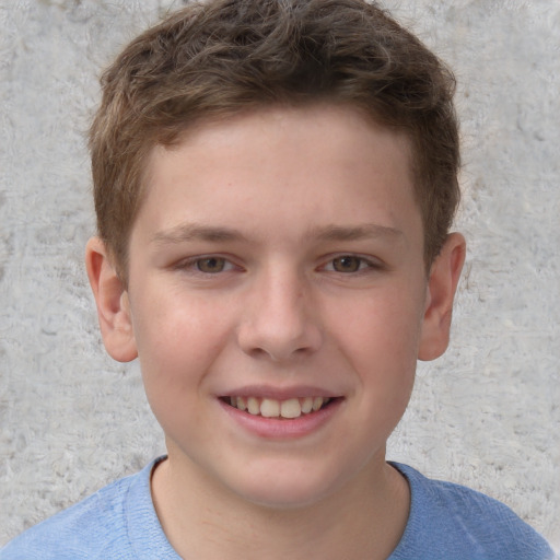 Joyful white child male with short  brown hair and grey eyes