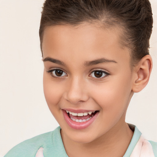 Joyful white child female with short  brown hair and brown eyes