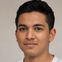 Joyful latino young-adult male with short  brown hair and brown eyes