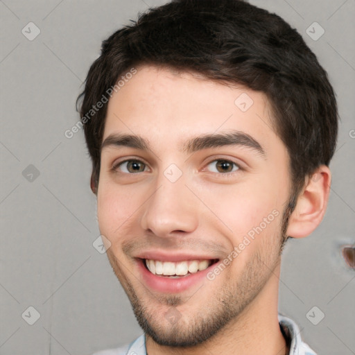 Joyful white young-adult male with short  black hair and brown eyes