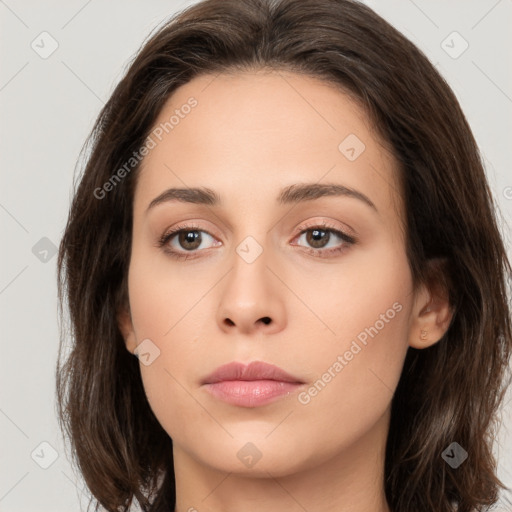 Neutral white young-adult female with long  brown hair and brown eyes