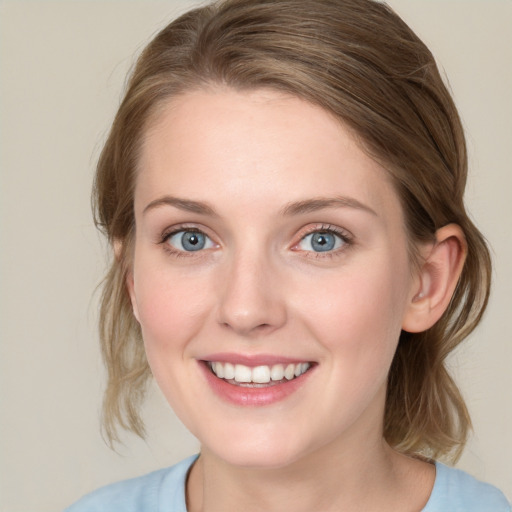 Joyful white young-adult female with medium  brown hair and blue eyes