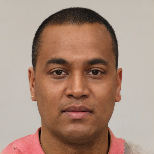 Neutral latino young-adult male with short  brown hair and brown eyes