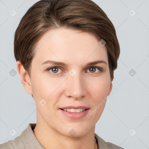 Joyful white young-adult female with short  brown hair and grey eyes