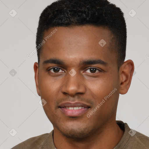 Joyful black young-adult male with short  brown hair and brown eyes