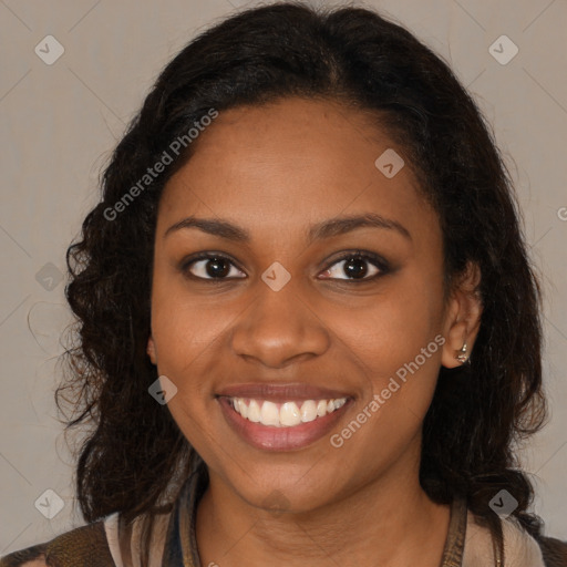 Joyful black young-adult female with medium  brown hair and brown eyes