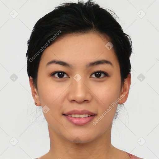 Joyful asian young-adult female with short  black hair and brown eyes