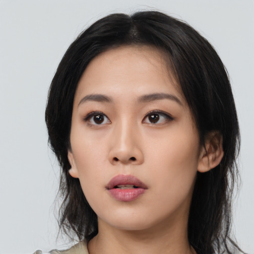 Neutral asian young-adult female with medium  black hair and brown eyes