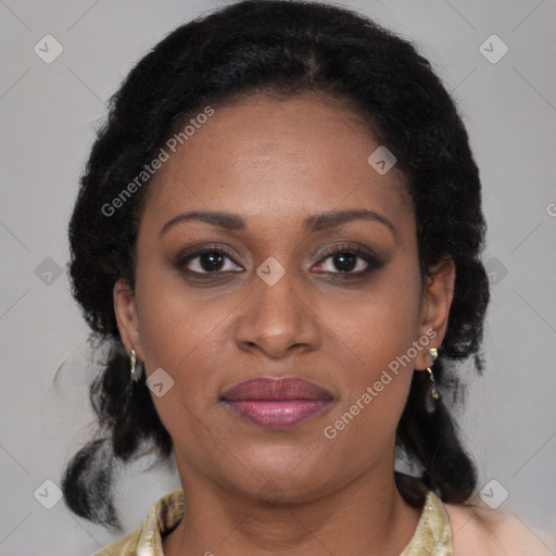 Joyful black adult female with medium  brown hair and brown eyes