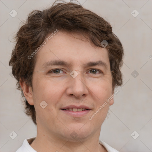 Joyful white adult male with short  brown hair and grey eyes