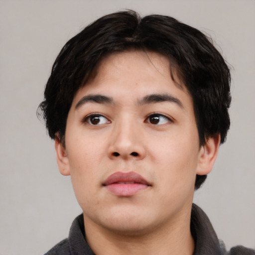Neutral white young-adult male with short  black hair and brown eyes