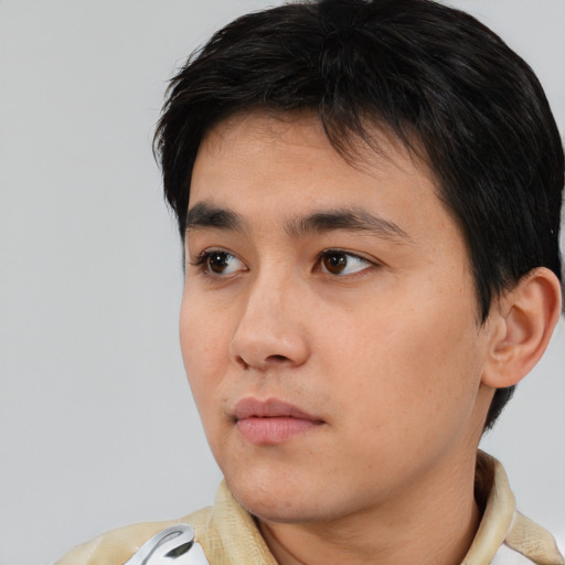 Neutral white young-adult male with short  black hair and brown eyes