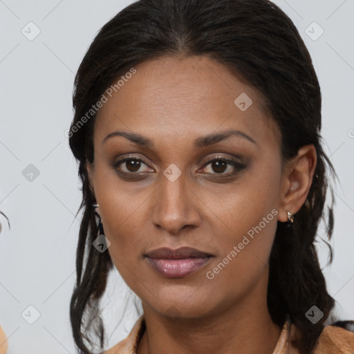 Joyful black young-adult female with medium  brown hair and brown eyes