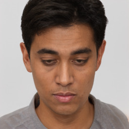 Neutral latino young-adult male with short  brown hair and brown eyes