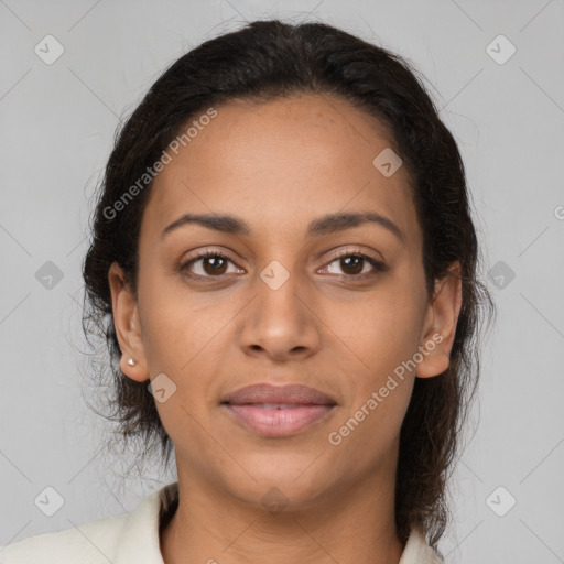 Joyful latino young-adult female with medium  brown hair and brown eyes