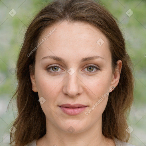 Joyful white young-adult female with medium  brown hair and green eyes