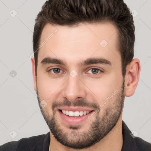 Joyful white young-adult male with short  brown hair and brown eyes