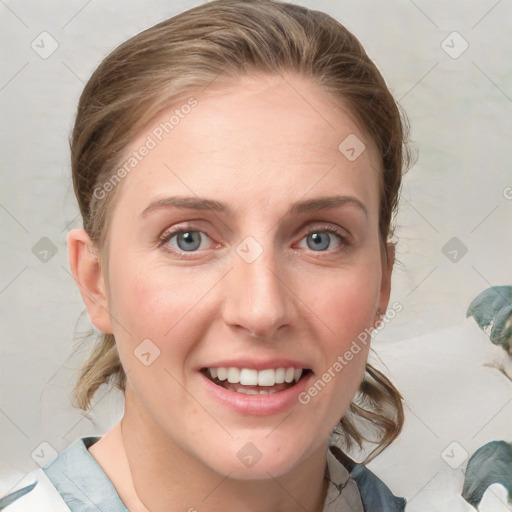 Joyful white young-adult female with medium  brown hair and blue eyes