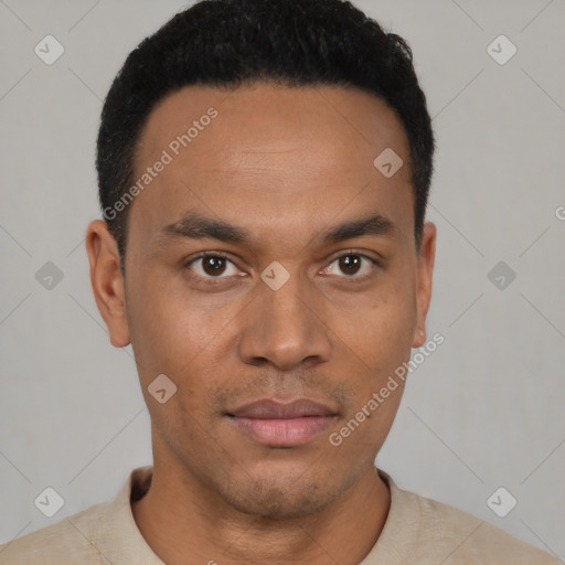 Joyful latino young-adult male with short  black hair and brown eyes