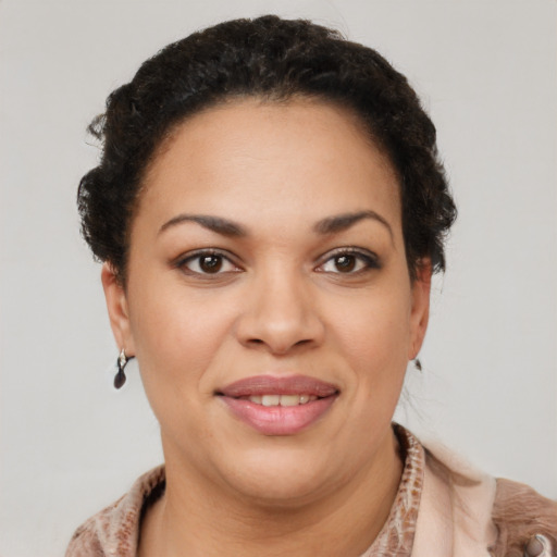 Joyful latino young-adult female with short  brown hair and brown eyes