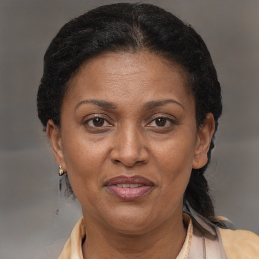 Joyful latino adult female with short  brown hair and brown eyes